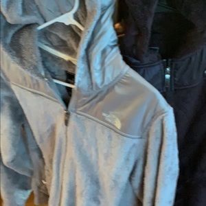 Woman’s grey and burgundy fleece north face